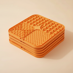 5 orange silicone lick mats stacked