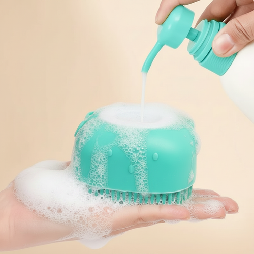 Teal silicone dog bath brush with shampoo being poured in